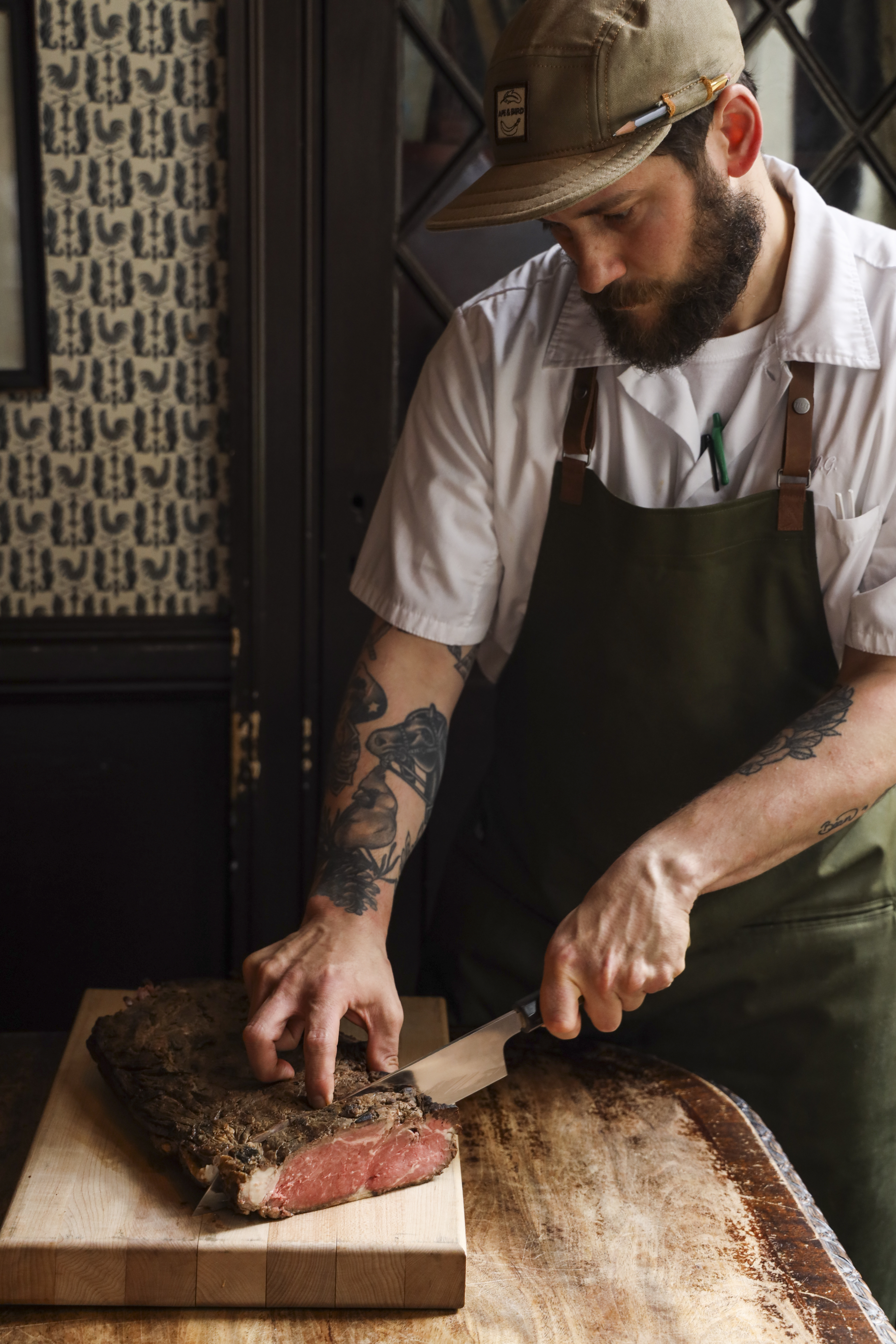 Chef slicing beef tenderloin